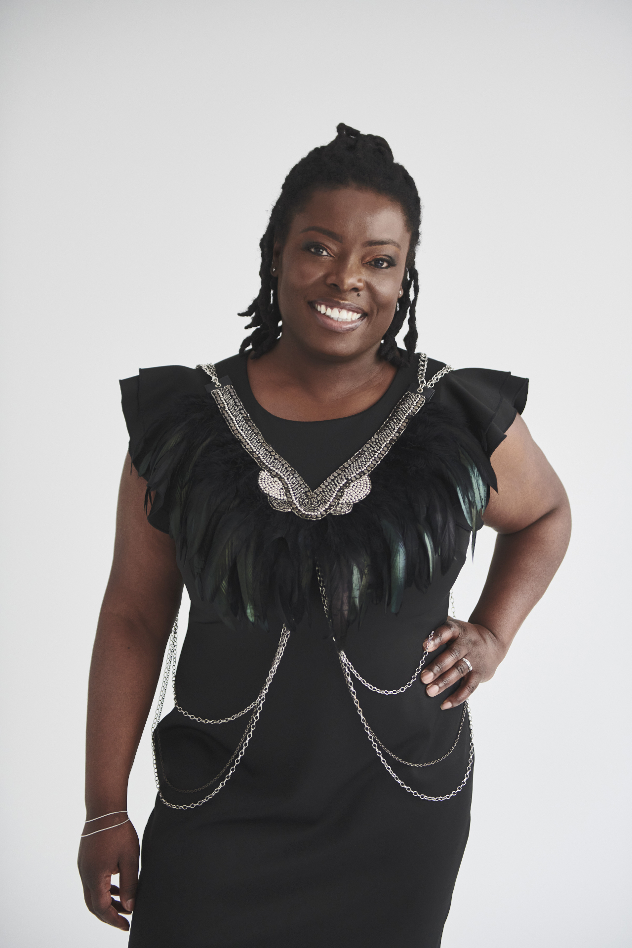 Afua Boateng, bilingual keynote speaker and leadership expert, on stage